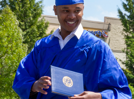 Student Holding Diploma